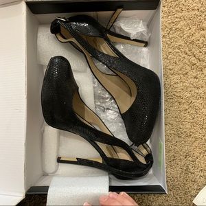 Black reptile heel closed toe heel